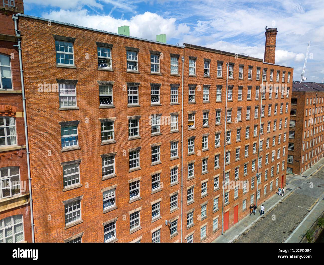 Red brick, old cotton mills buildings next to Rochdale canal in Ancoats, Manchester Stock Photo