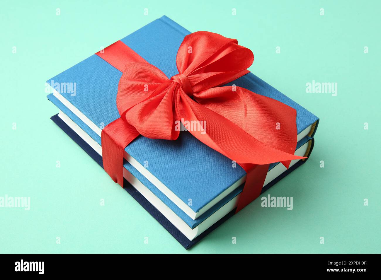 Books tied with ribbon hi-res stock photography and images - Alamy