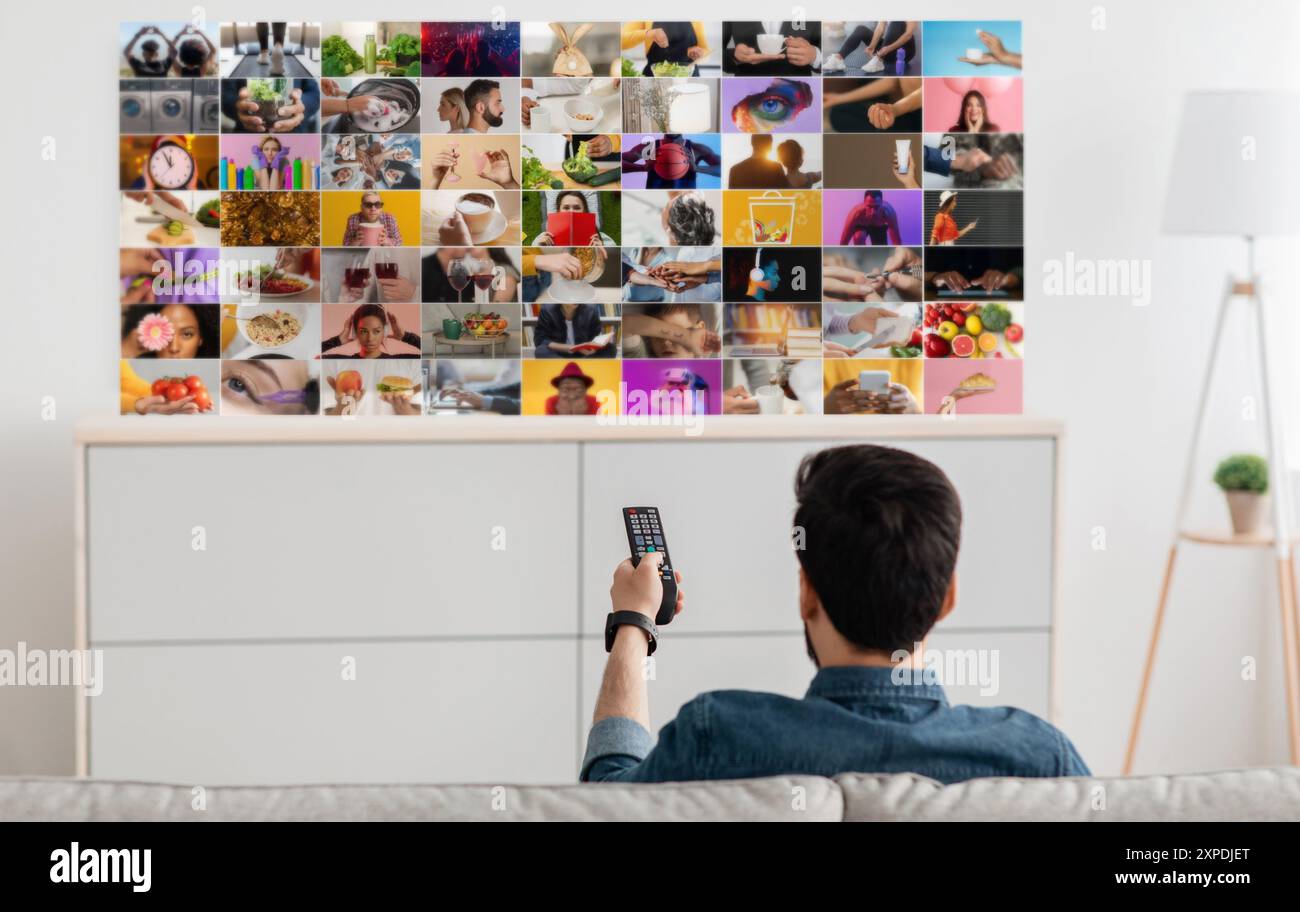 Man Using Remote Control Using white remote control hi-res stock photography and images - Alamy