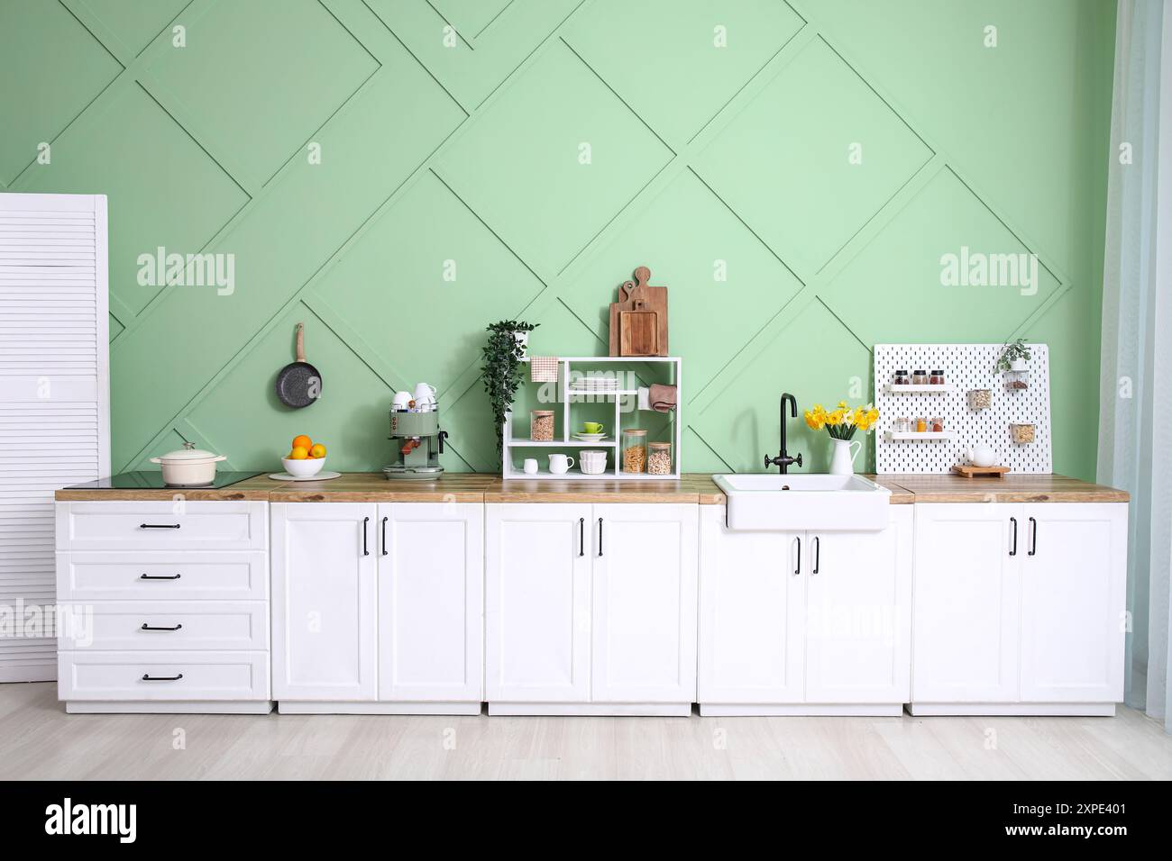 Interior of modern kitchen with stylish counter, stove and sink Stock ...