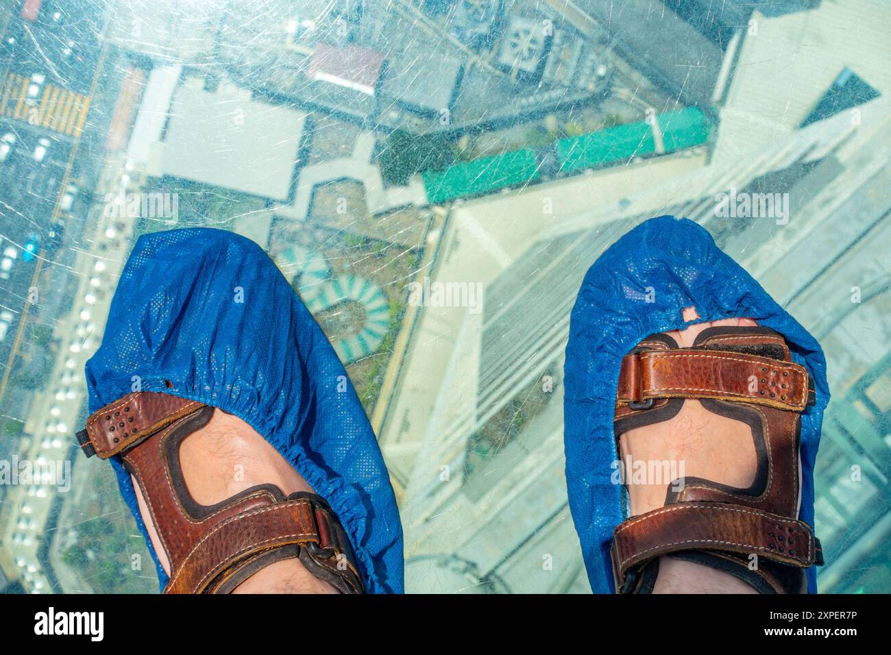 Looking down through a glass floor, part of the rainbow walk at 'The Top', Kontar Tower, George Town, Penang, Malaysia Stock Photo