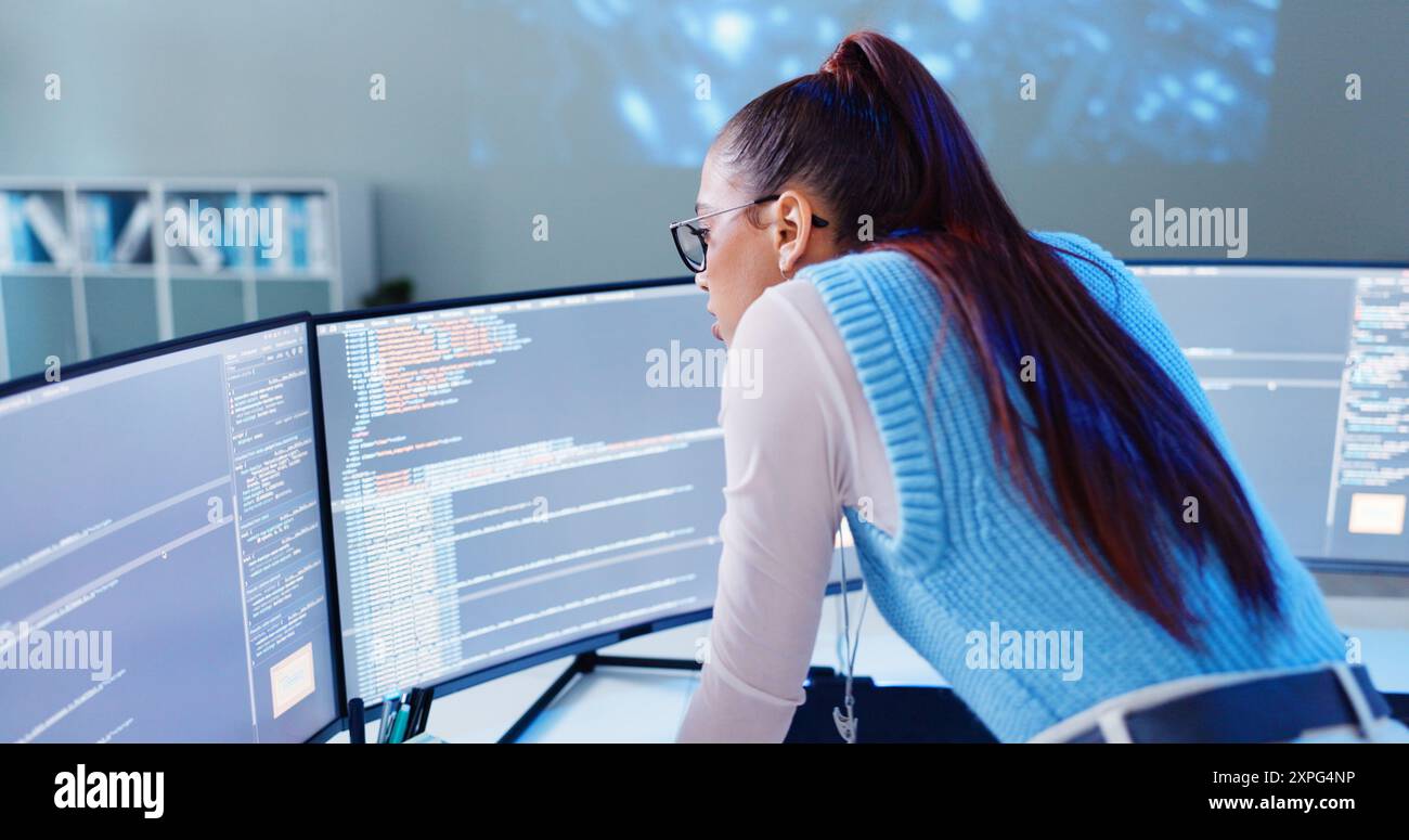 Woman, computer screen and thinking in office for code, software development and programming. Female developer, tech and reading at desk for Stock Photo