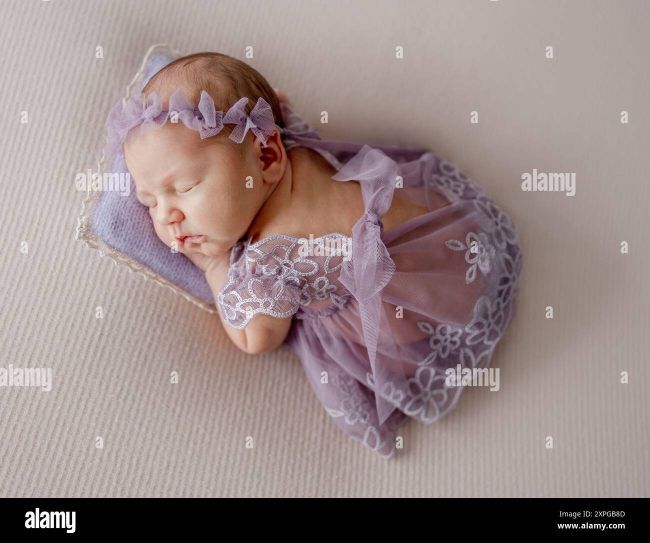 Newborn Girl In Lace Dress Sleeps In Lavender Tones Photo Stock Photo -  Alamy