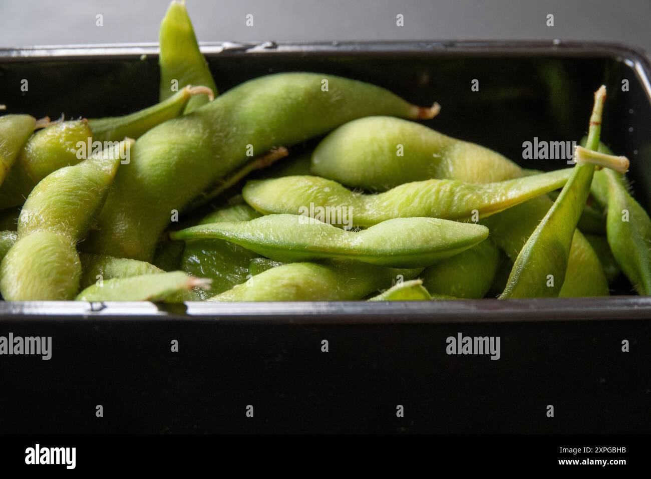 Sweet edamame peas in a tray. Stock Photo
