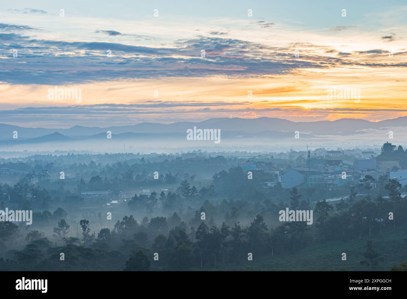 Beautiful misty forest mountain landscape at sunset Stock Photo - Alamy