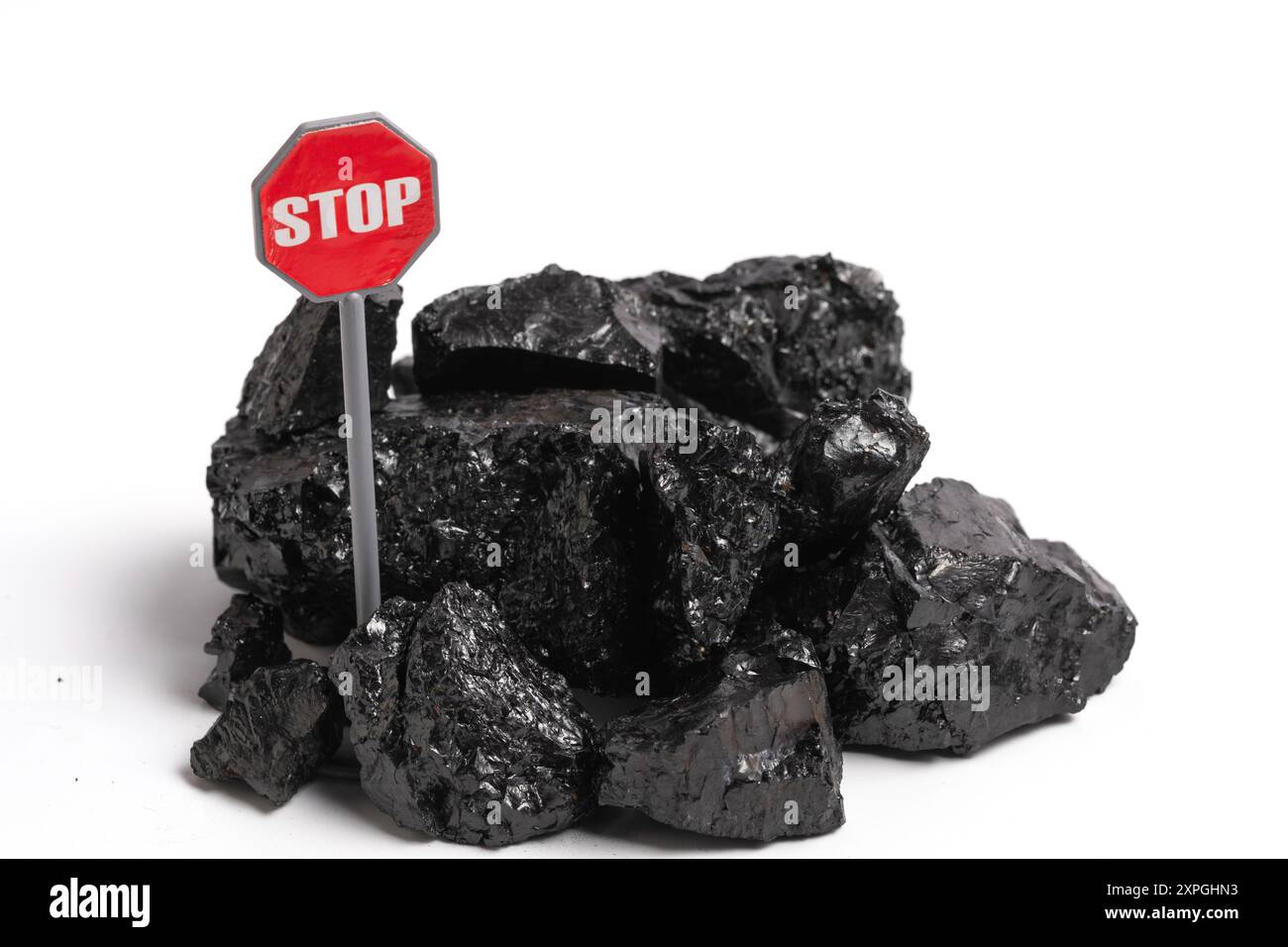Stop Sign Piling Pile of coal with stop sign isolated on a white background Stock Photo ...