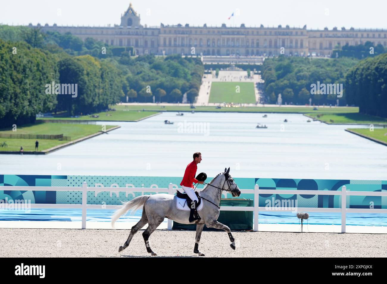 Germany's Christian Kukuk aboard Checker 47 on a lap of honour ...