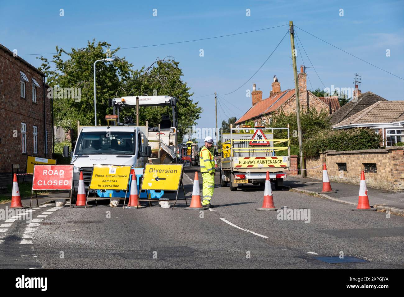 Resurfacing road, High Street, Cherry Willingham, Lincoln, Lincolnshire, England, UK Stock Photo