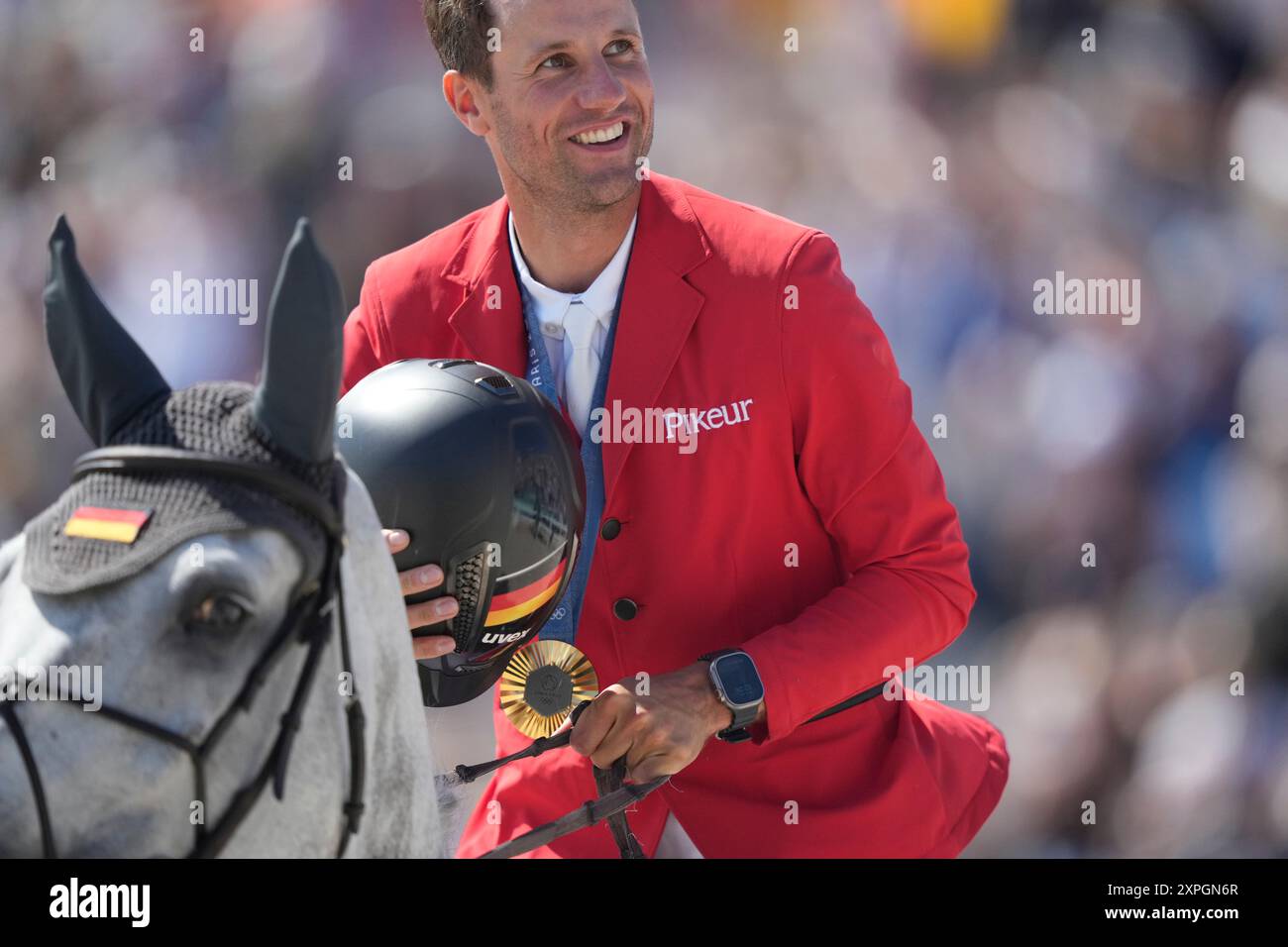 Germany's Christian Kukuk, rideing Checker 47, celebrates his gold ...