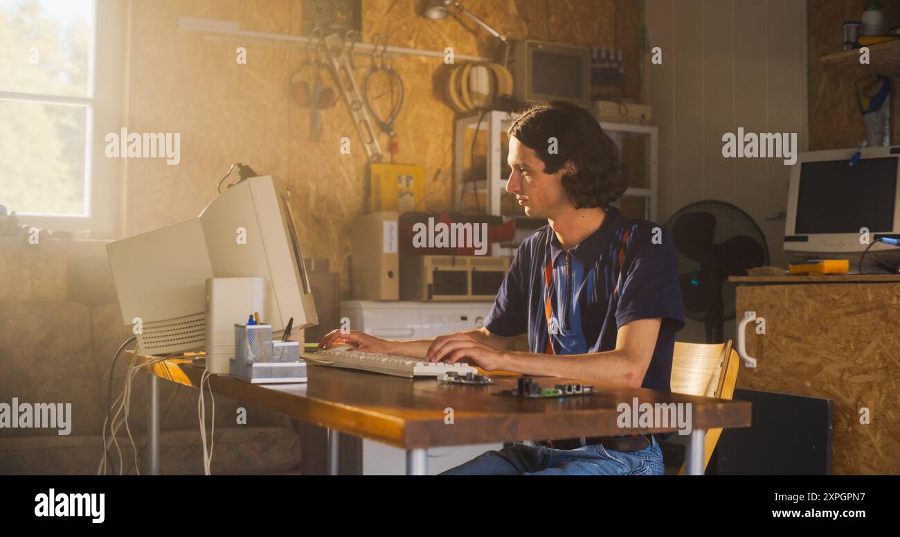 Caucasian Male Computer Engineer Coding On Old Desktop PC And ...