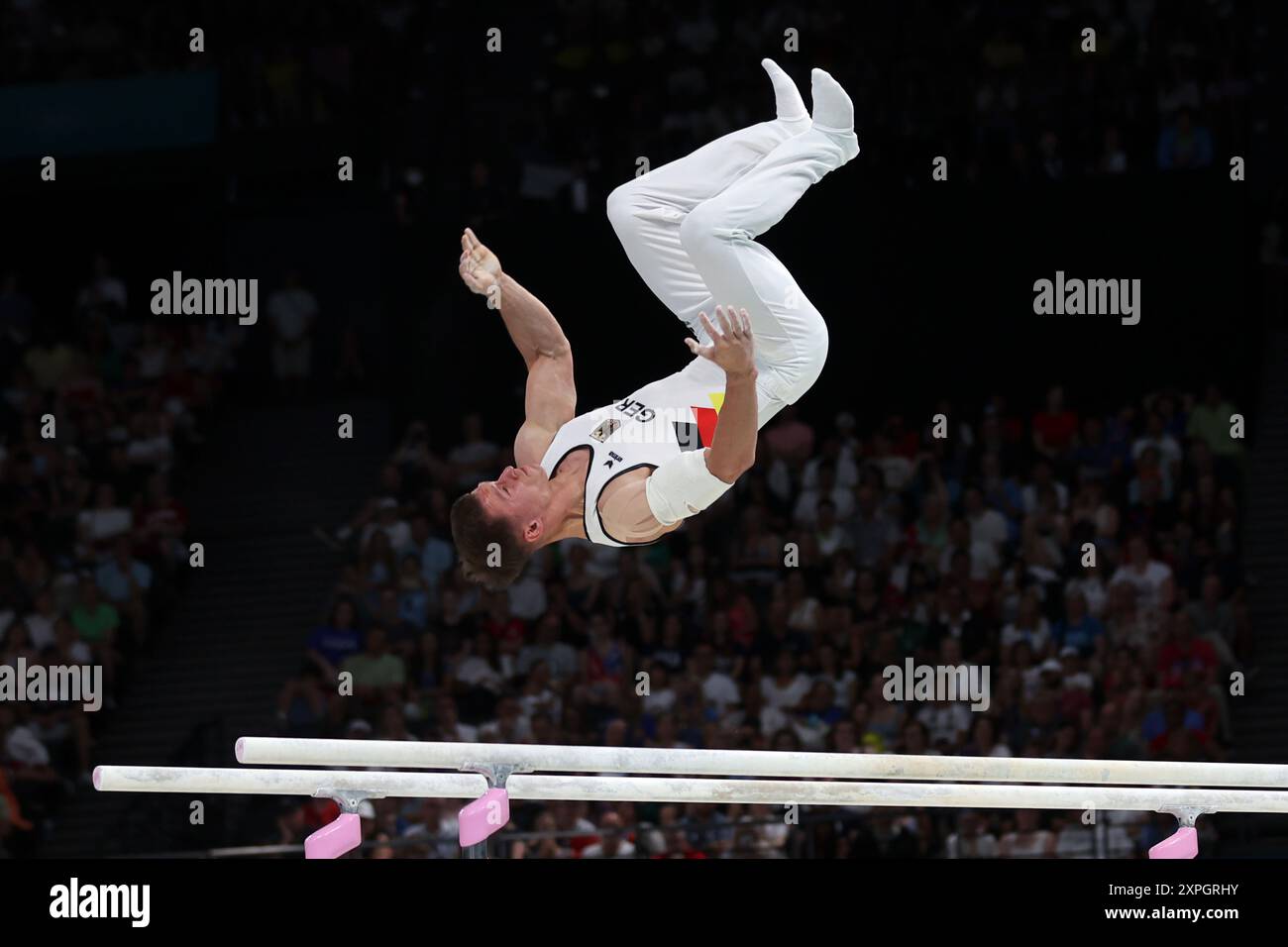 PARIS, FRANCE - AUGUST 05: Lukas Dauser of Germany competes during the Artistic Gymnastics - Men's Parallel Bars on day ten of the Olympic Games Paris 2024 at Bercy Arena on August 05, 2024 in Paris, France. Stock Photo