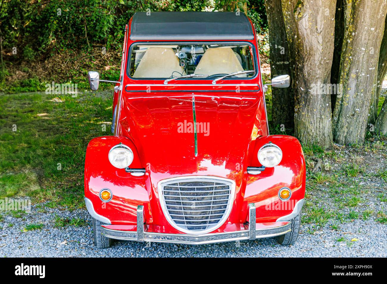 Vintage convertible luxury car with soft top, red body with chrome ...