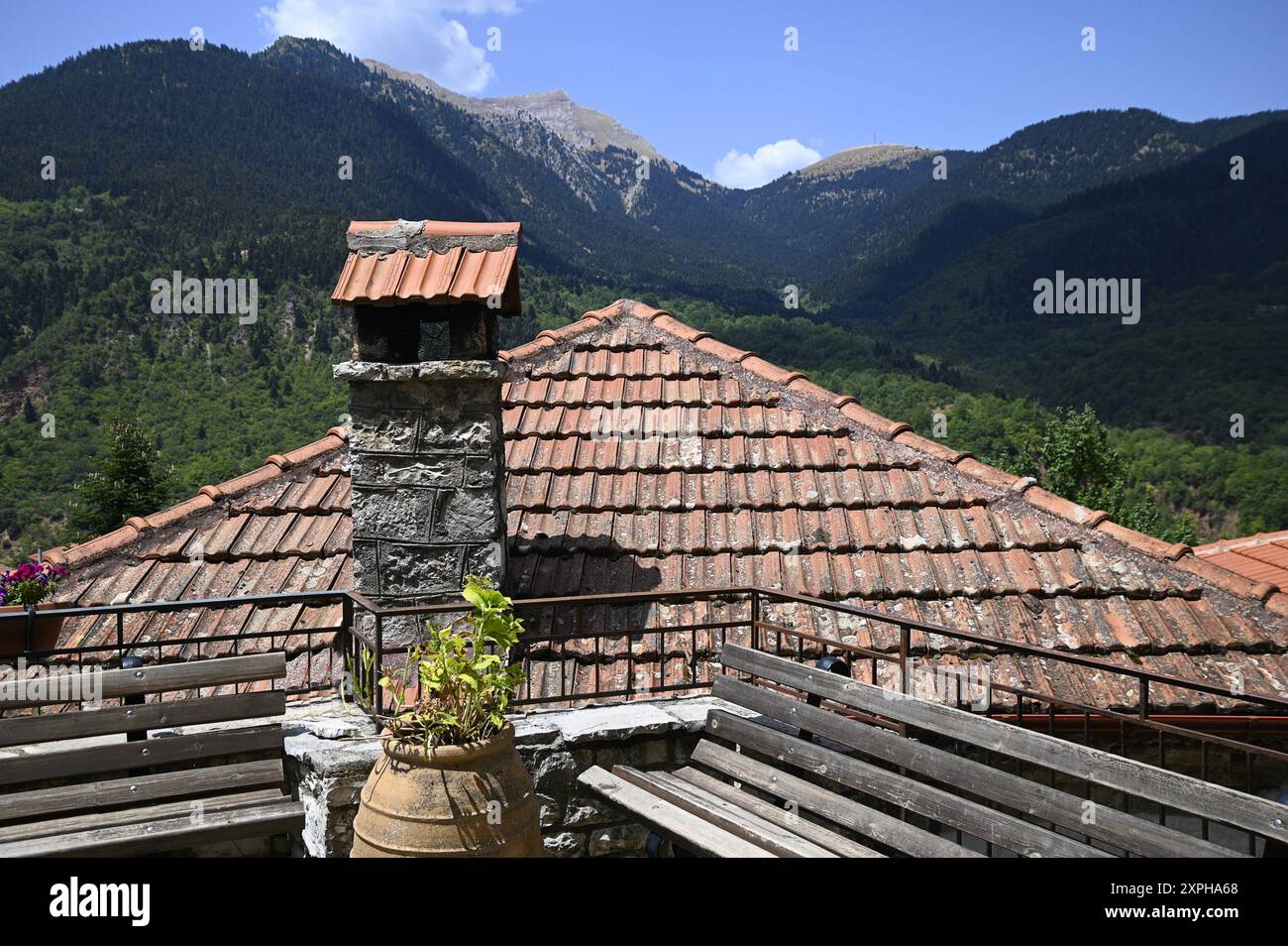 Traditional rural house clay tile rooftop with a handcrafted stone ...