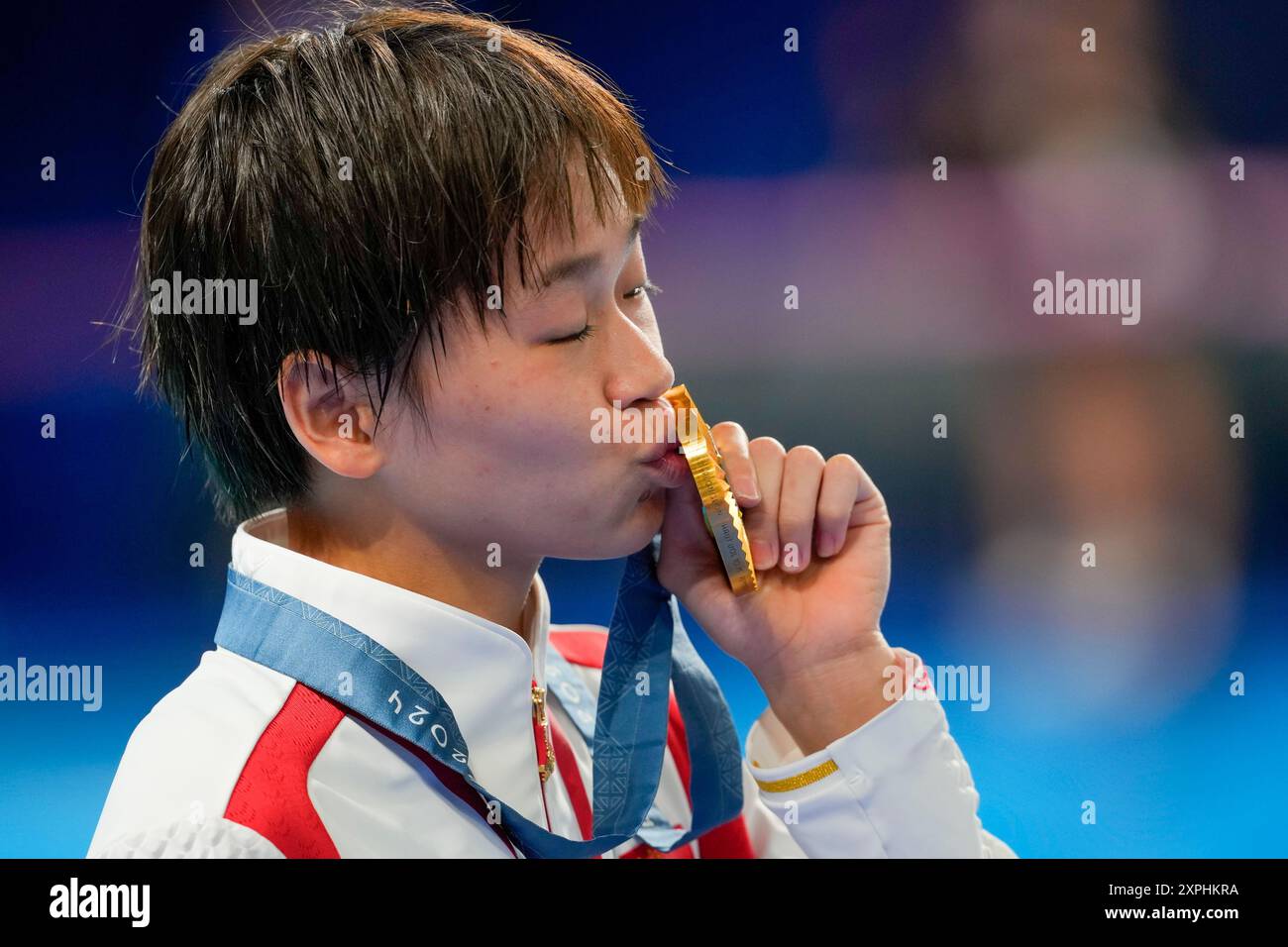 China's Quan Hongchan celebrates after winning the gold medal at the ...