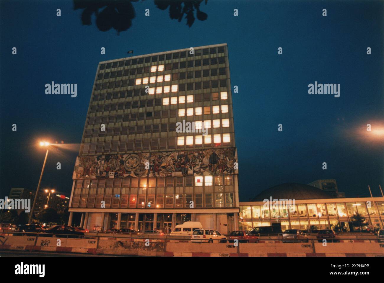 This photo captures the Blinkenlights installation by the Chaos Computer Club on the Haus des Lehrers building in Alexanderplatz, Berlin, Germany, in September 2001. The artistic light installation illuminates the night cityscape. Stock Photo