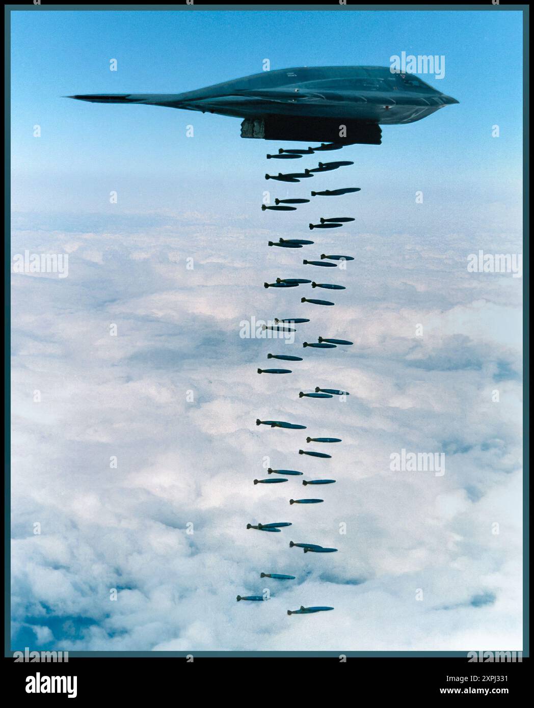 B-2 B2 Spirit 'Stealth Bomber' dropping Mk.82 bombs into the Pacific Ocean in a 1994 training exercise off Point Mugu, California, near Point Mugu State Park. America USA Stock Photo