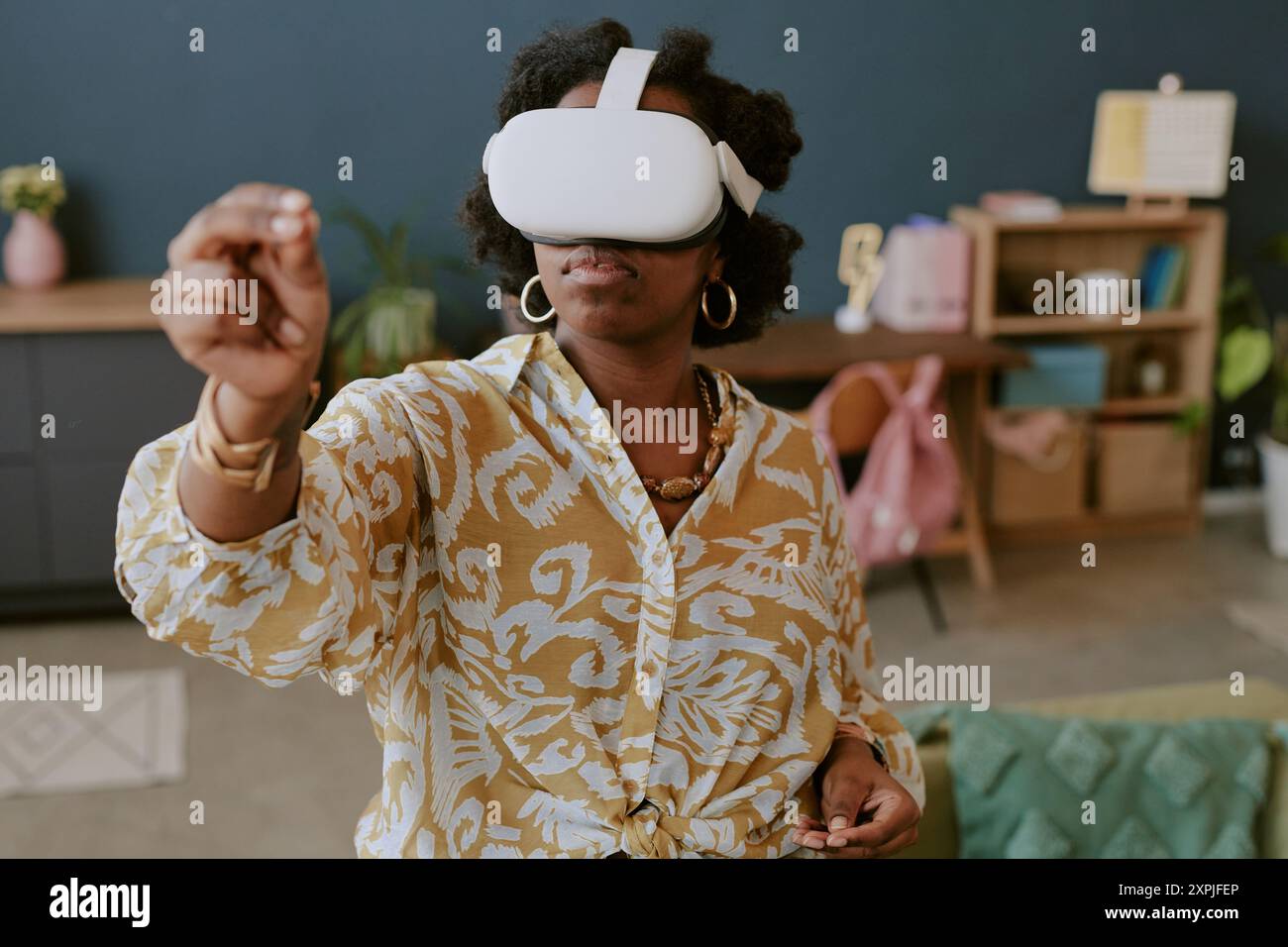 Experiencing Virtual Reality in Modern Living Room Stock Photo - Alamy