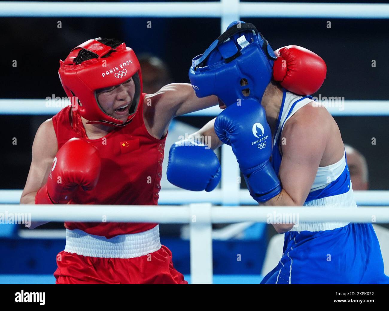 China’s Yu Wu (left) in action against Kazakhstan’s Nazym Kyzaibay ...
