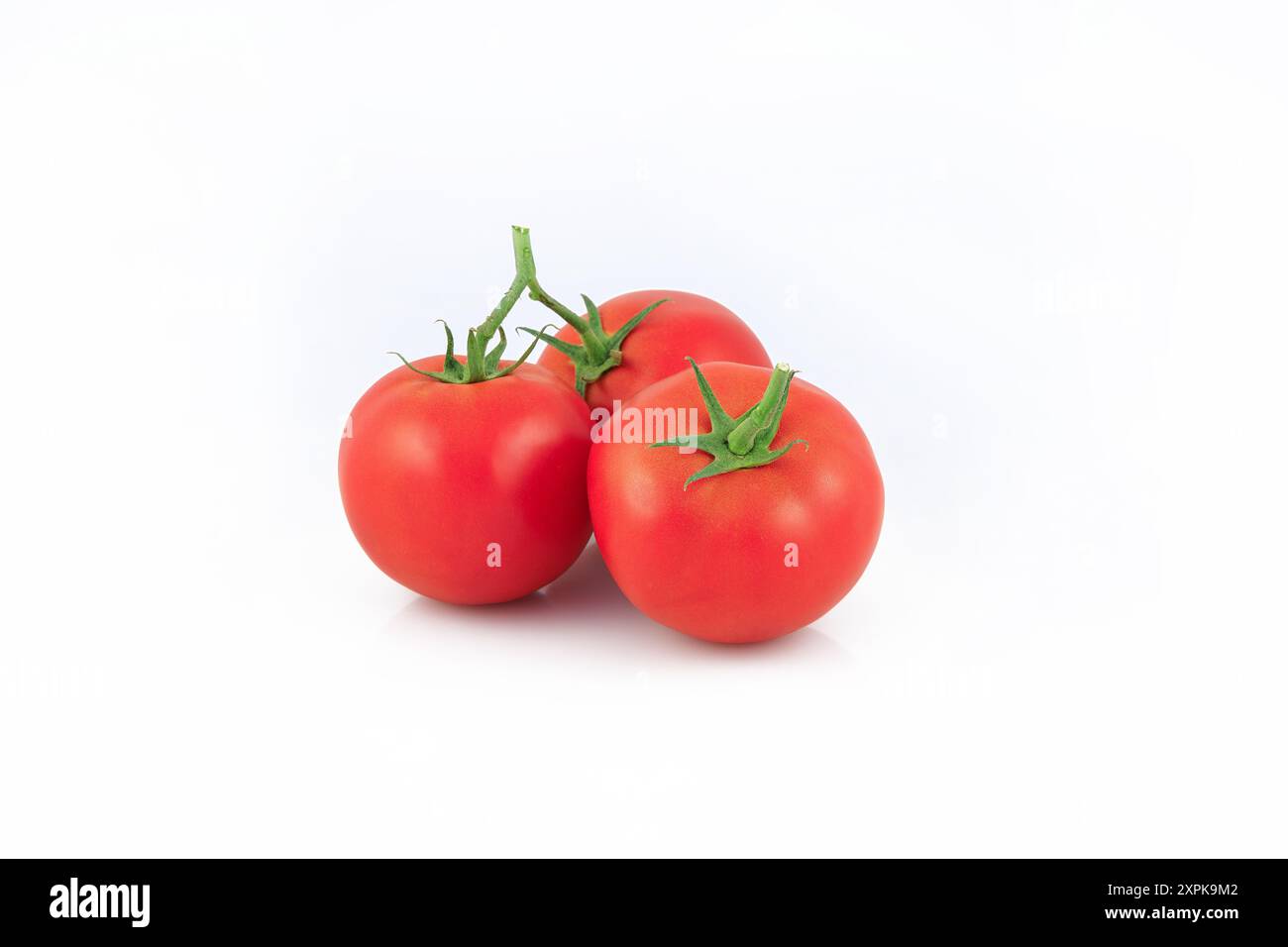 Fresh tomatoes isolated on white background. Stock Photo