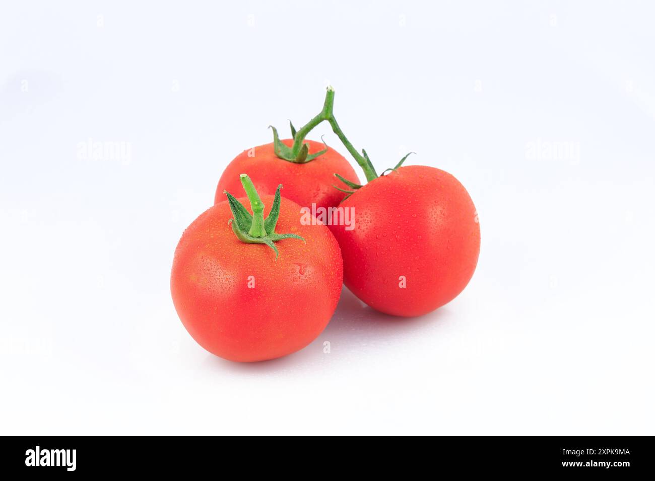 Fresh tomatoes with water droplets isolated on white background Stock ...