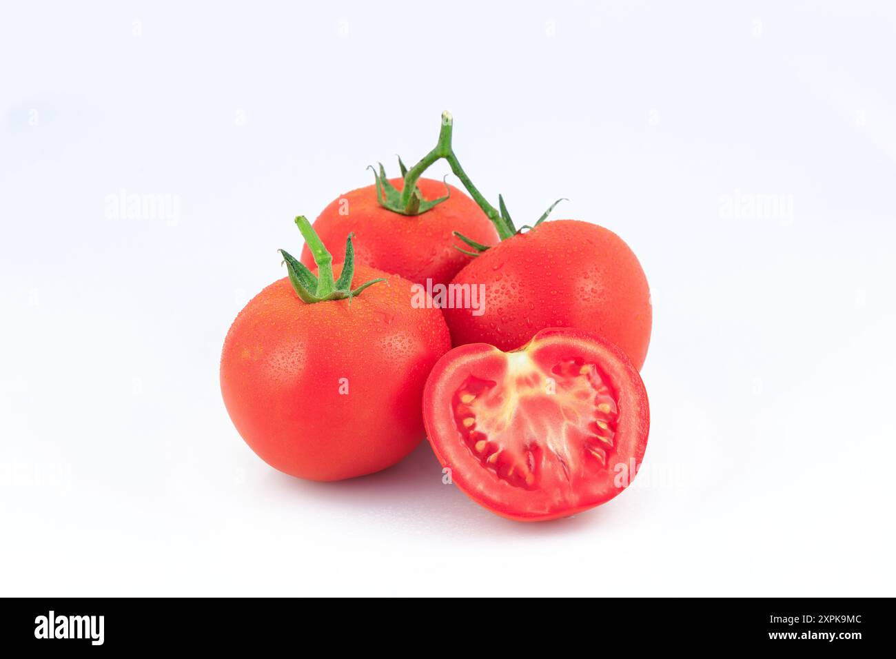 Fresh tomato with water droplets isolated on white background Stock ...