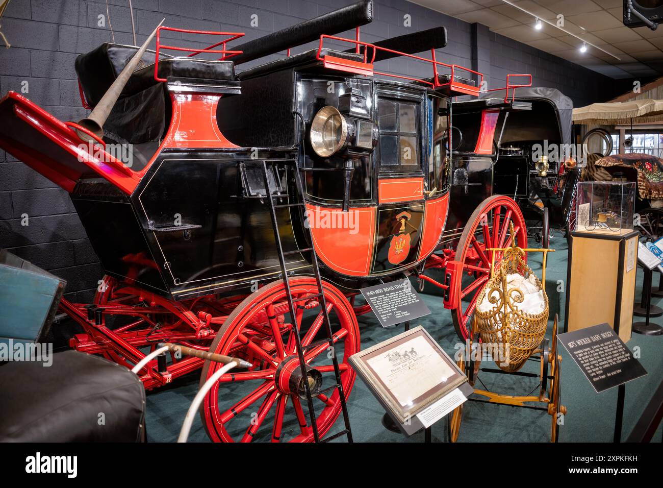 LURAY, Virginia, United States — An 1840-1850 Road Coach on display at the Car and Carriage Caravan Museum in Luray, Virginia. This vehicle, made by Holland & Holland in London, England, was the 'bus' of its period, capable of transporting 20 people and their luggage, and pulled by four horses. Stock Photo