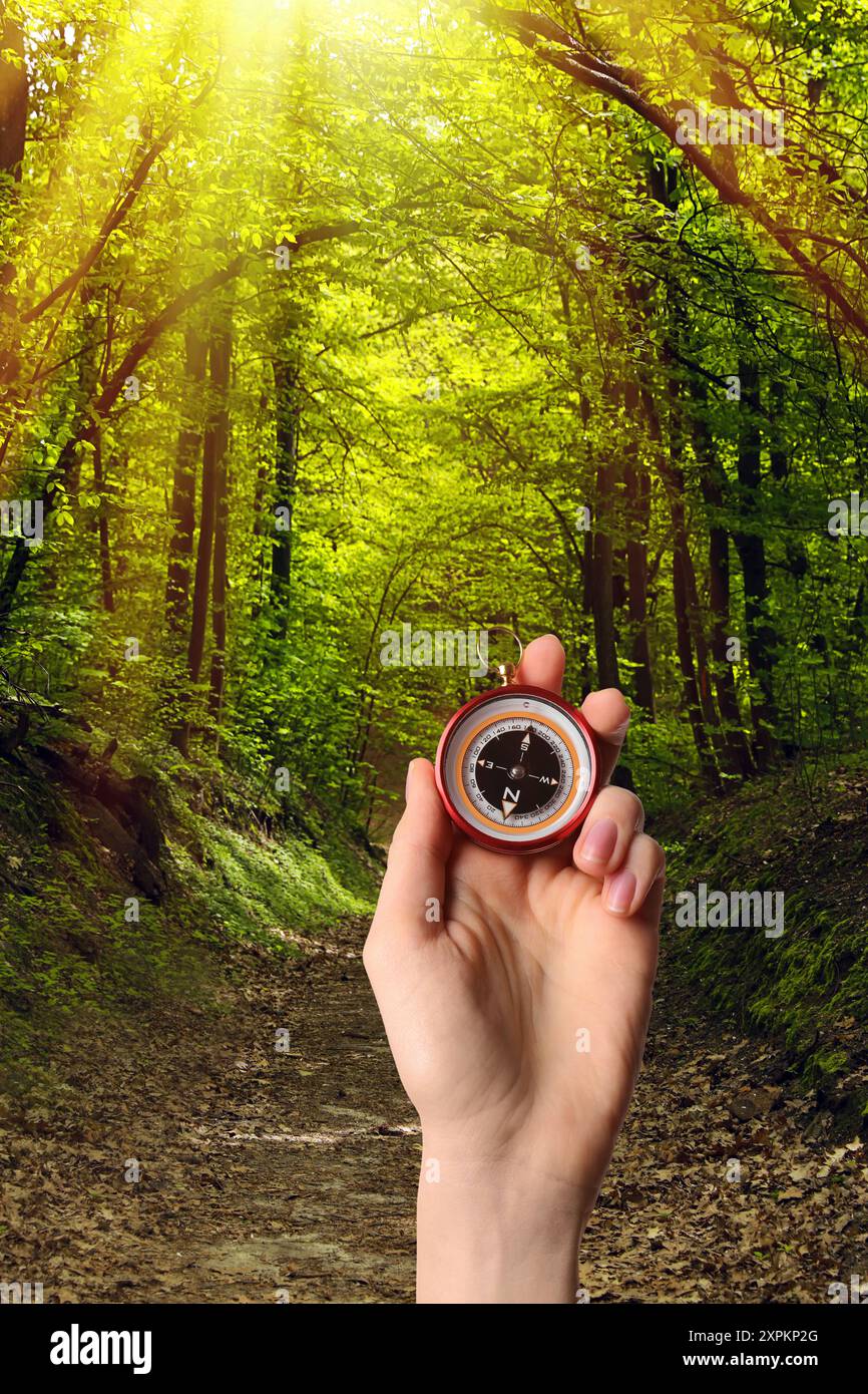 Woman holding big direction arrow hi-res stock photography and images ...