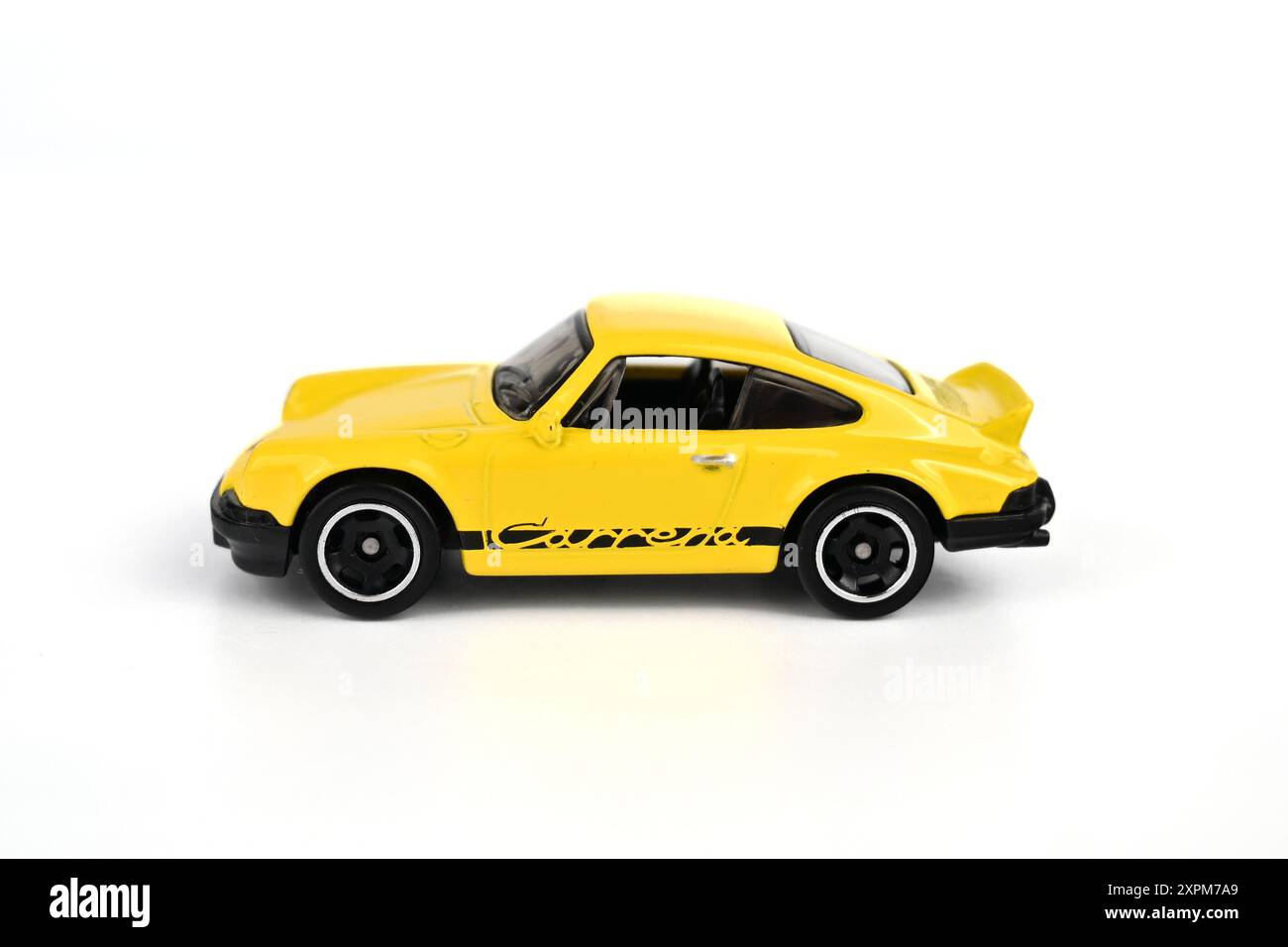 Hot Wheels Porsche 911 Carrera RS 2.7 in yellow on white background – Wales, UK – 27  July 2024 Stock Photo