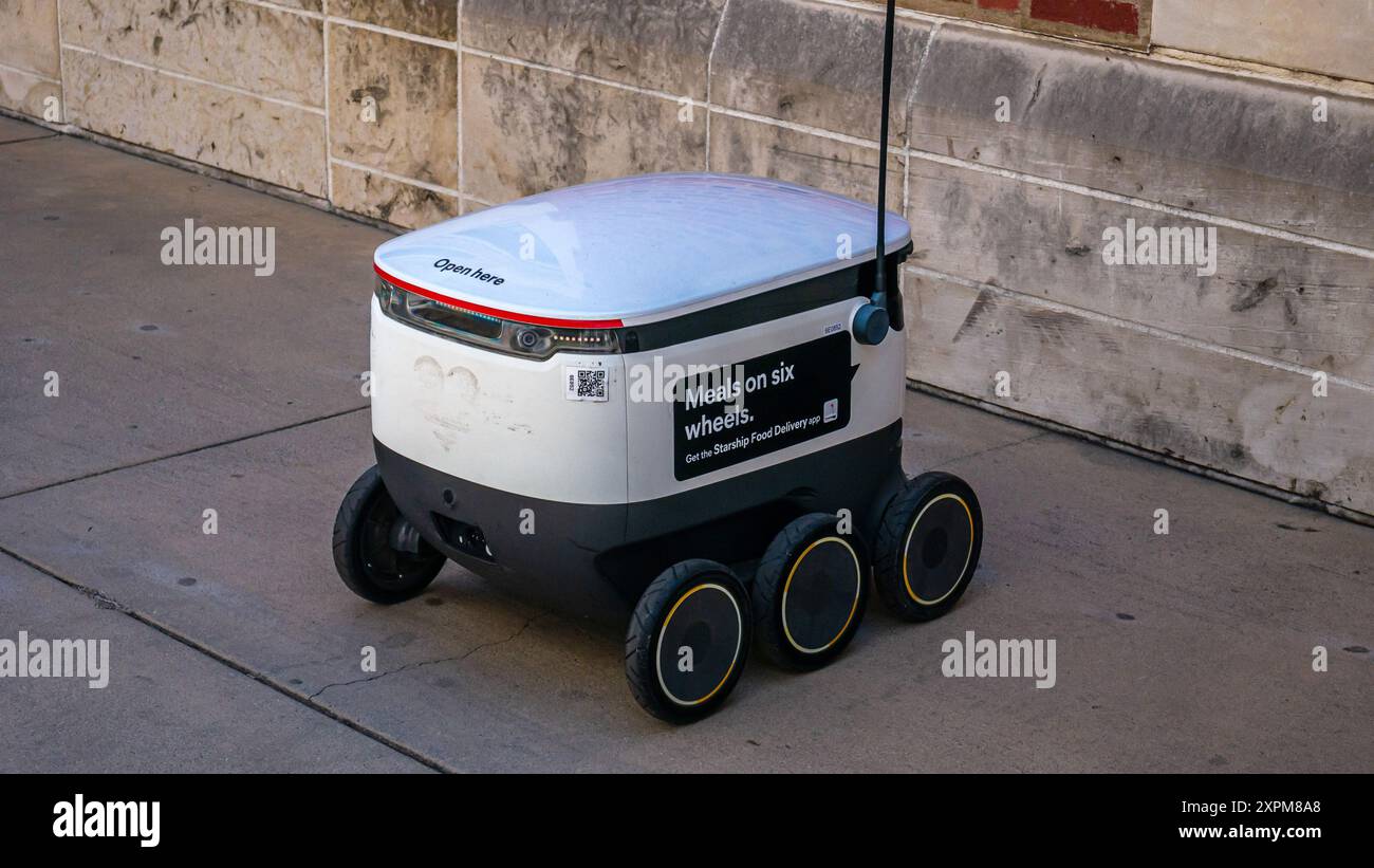 A Starship food delivery robot on the UCLA college campus, autonomous delivery service, Los Angeles, California, USA Stock Photo