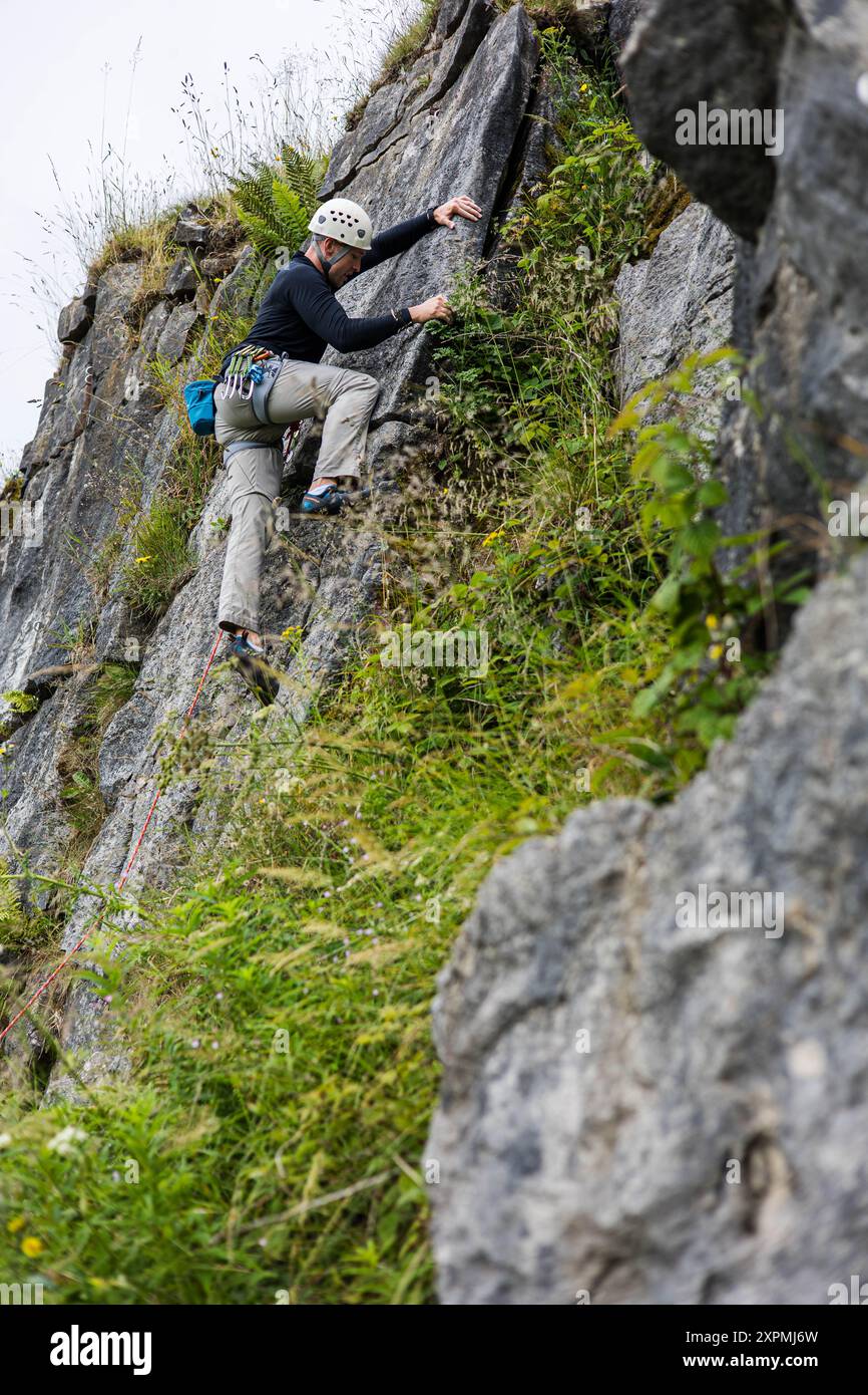 Rock Incline Male Rock Climber at Harpur Hill Quarry, Buxton, Peak District, England ...