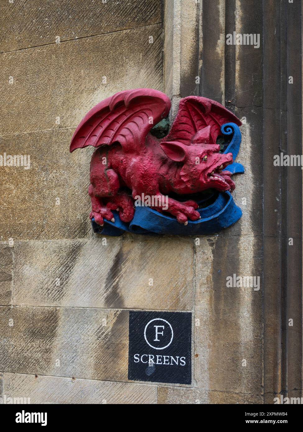 Wall mounted carved stone dragon sculpture, Second Court, Christs College, Cambridge, UK Stock Photo