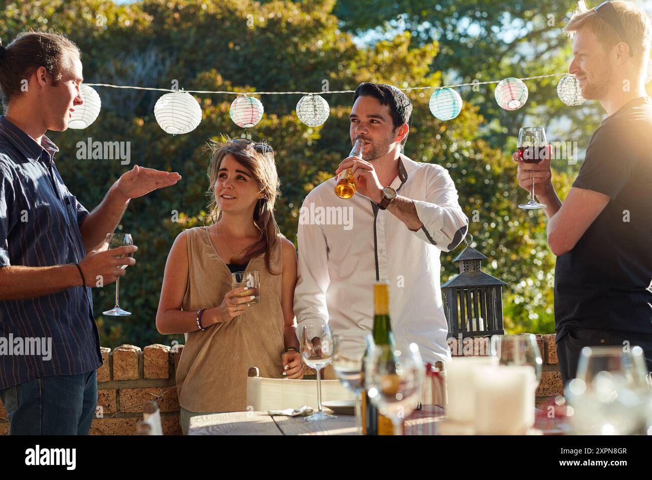 Friends, drink and beers in backyard, party and happy with conversation ...