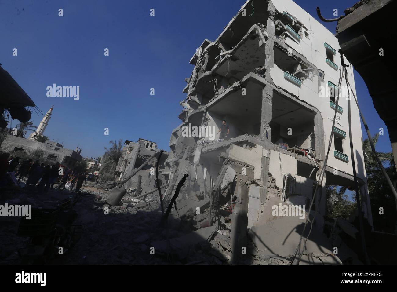 Palestinians check the destruction in Deir el-balah in the central Gaza Strip. Palestinians check the destruction in Deir el-balah in the central Gaza Strip, on August 7, 2024, following Israeli bombardment amid the ongoing conflict between Israel and the Palestinian Hamas militant group. Photo by Omar Ashtawy apaimages Deir el-balah Gaza Strip Palestinian Territory 070824 Dair El-Balah OSH 0073 Copyright: xapaimagesxOmarxAshtawyxxapaimagesx Stock Photo