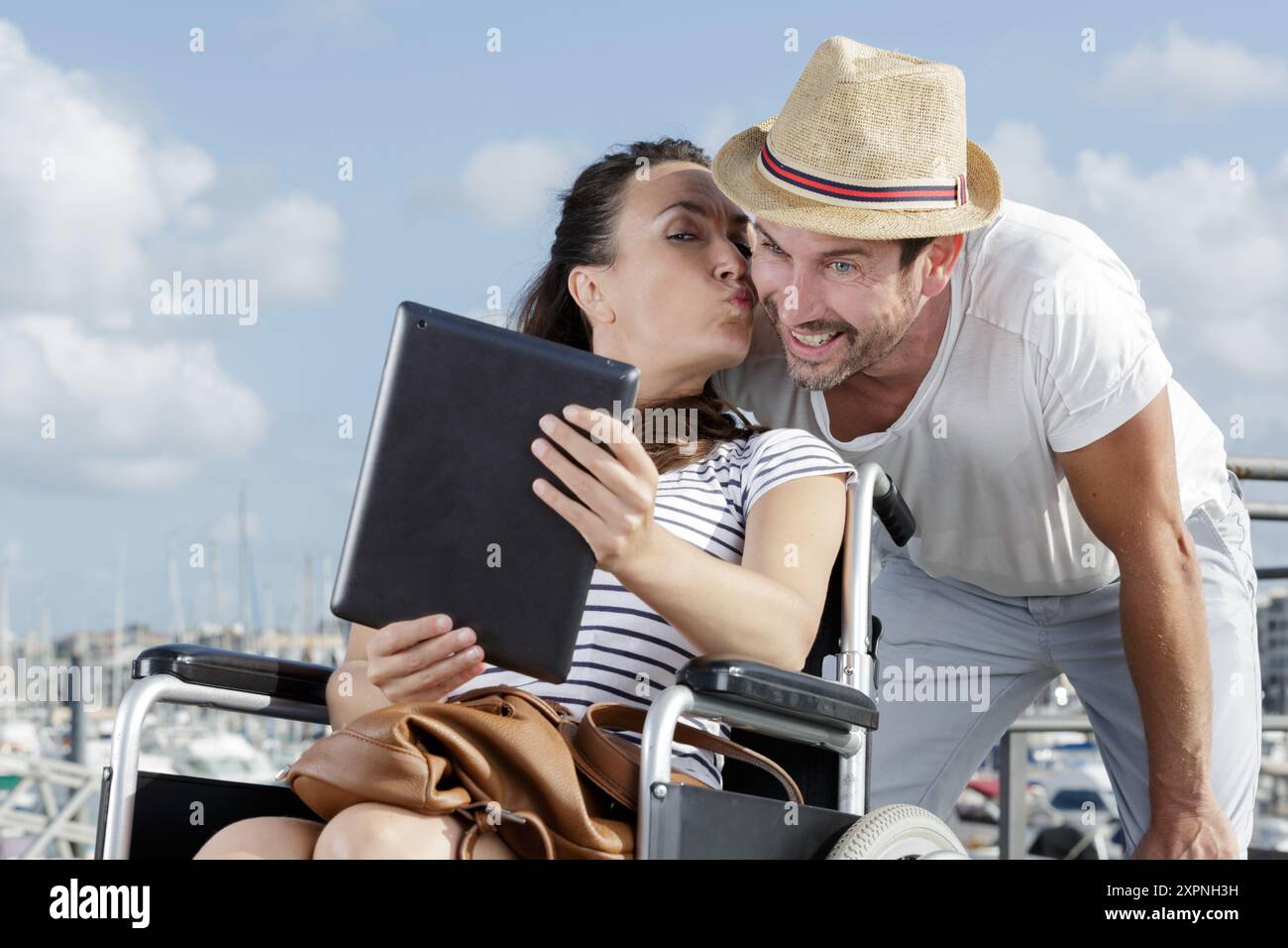 disabled person in a wheelchair and husband doing a selfie Stock Photo ...