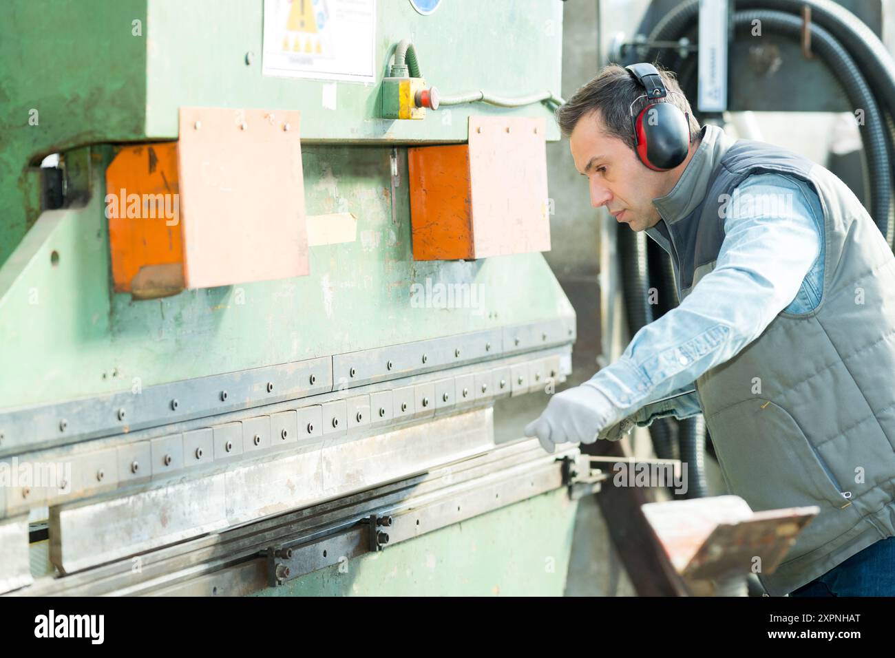 engineer checking on production in factory Stock Photo
