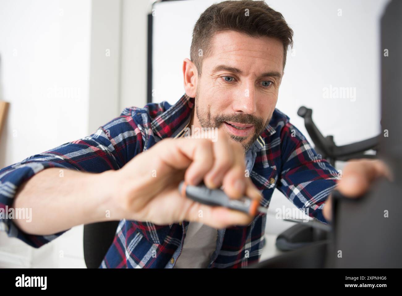 engineer repairs computers hard drive Stock Photo