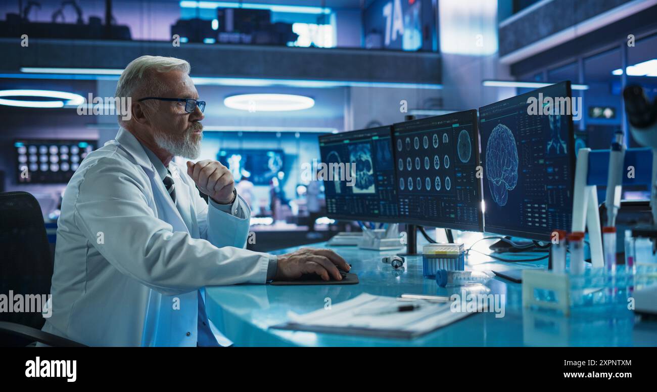 Senior Male Neuroscientist Using Desktop Computer To Analyze MRI Scans ...