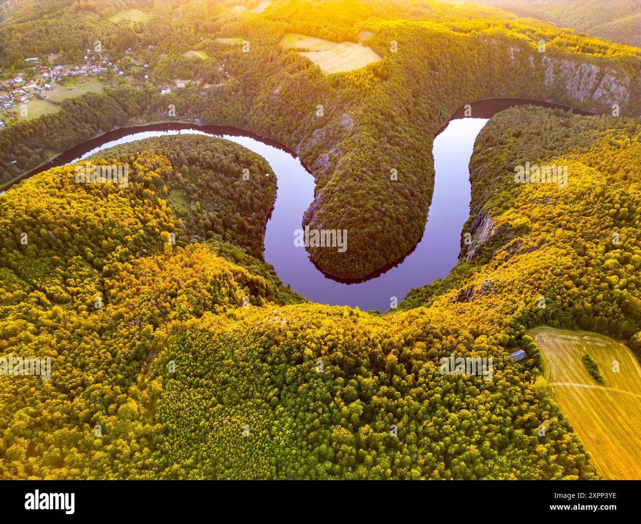 The Vltava River weaves gracefully through lush green landscapes in ...