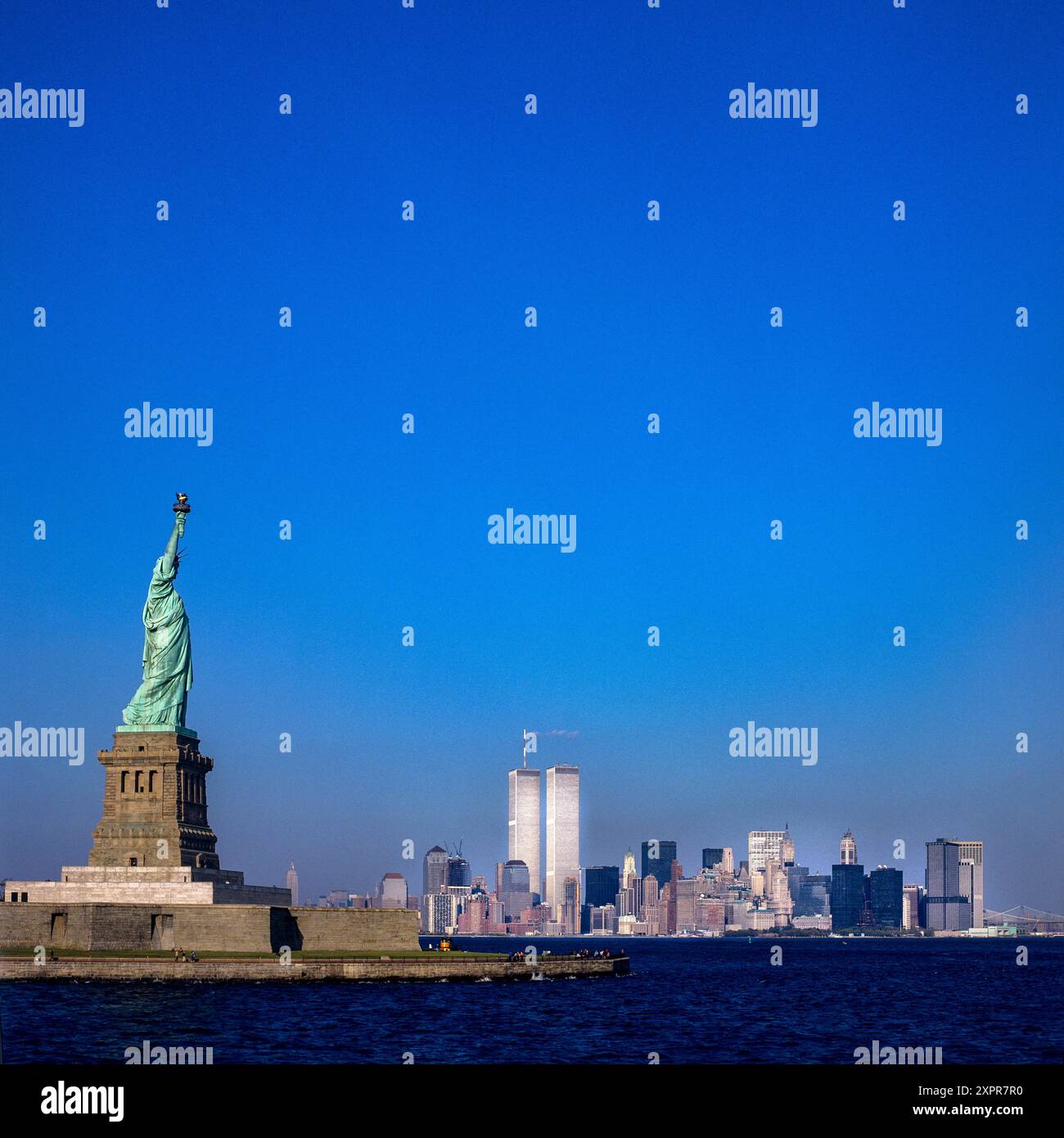 1980s Statue of Liberty, lower Manhattan skyline, WTC World Trade Center twin towers, prior to September 11 2001, New York City, NYC, NY state, USA, Stock Photo