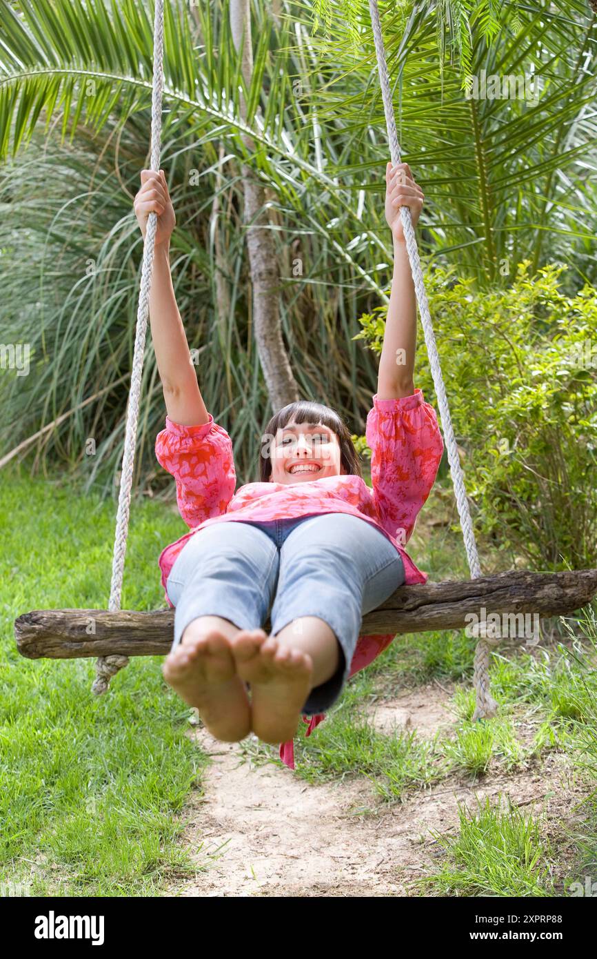 Carefree barefoot woman smiles hi-res stock photography and images - Alamy