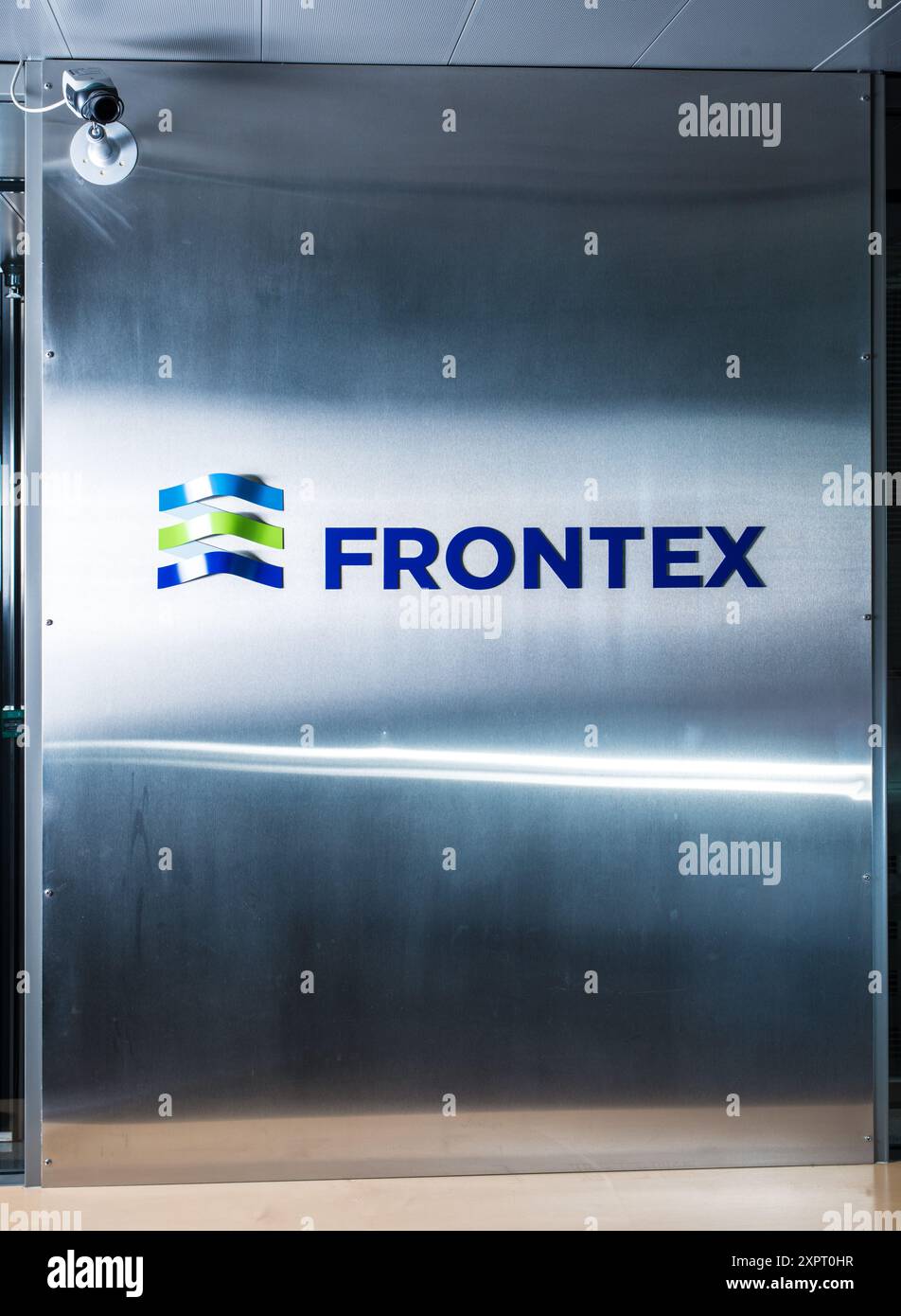 The Frontex logo prominently displayed at the headquarters in Warsaw, Poland. This EU agency is responsible for coordinating the surveillance and protection of the European Union's external borders. Stock Photo