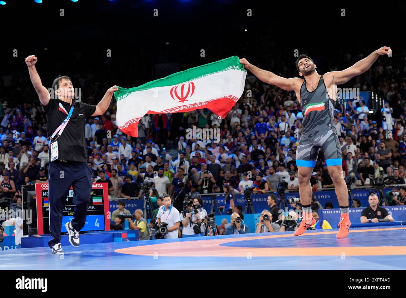 Iran's Mohammadhadi Saravi celebrates with his coach after defeating ...