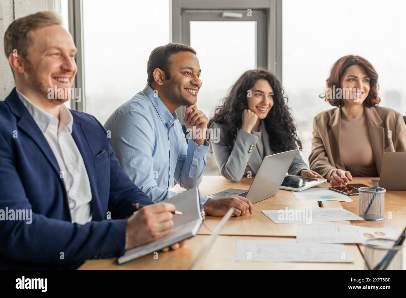 Business Professionals Collaborating in Modern Office Setting Stock Photo