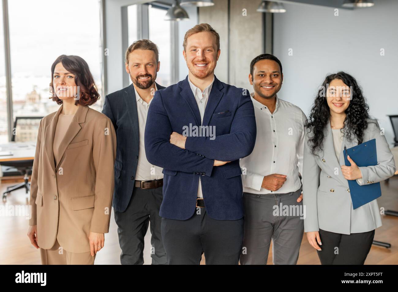 Diverse Business Team Standing Together in Modern Office Space Stock ...