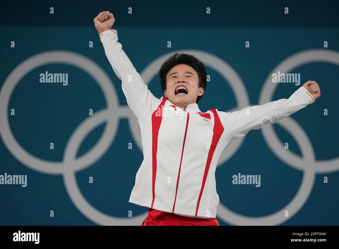 Gold medalist Hou Zhihui of China celebrates on the podium during the ...