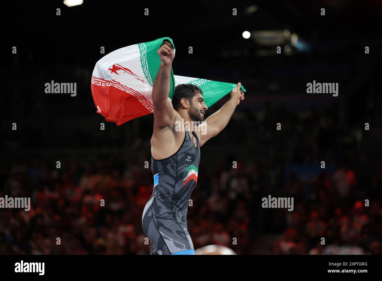 Iran's SARAVI Mohammadhadi celebrates after winning the Men's Greco ...