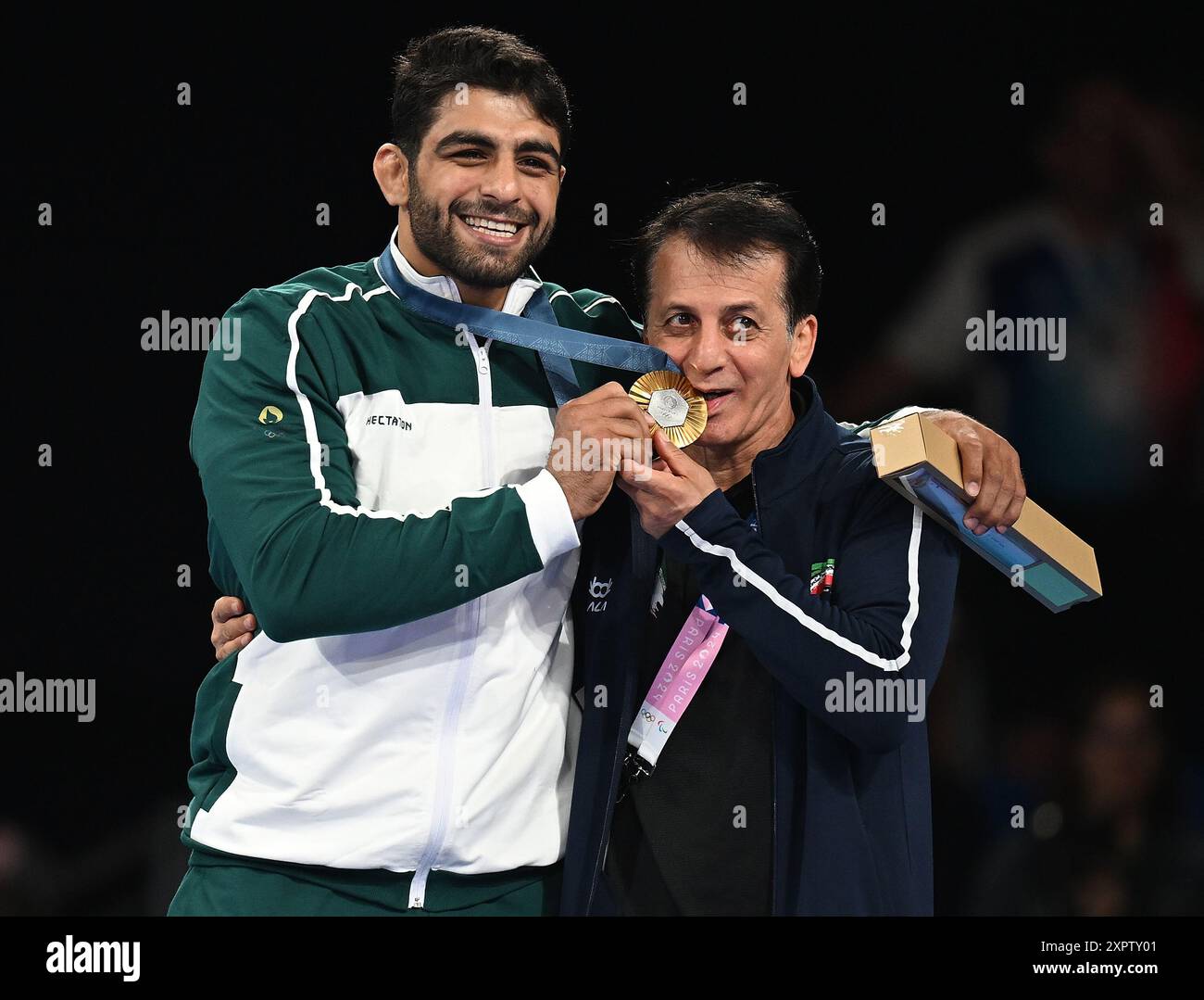 Paris, France. 7th Aug, 2024. Gold medalist Mohammadhadi Saravi (L) of ...
