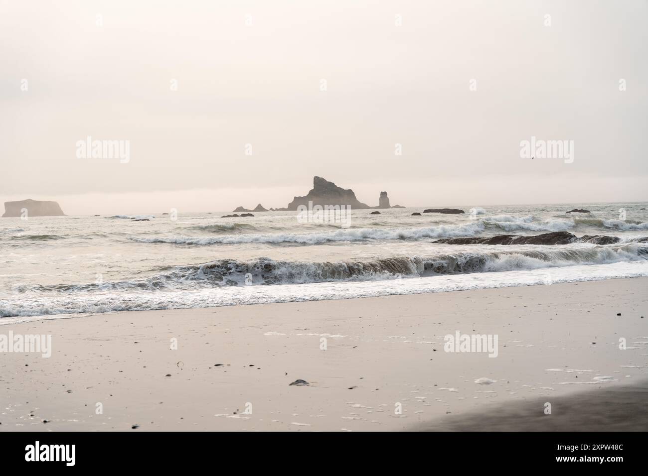 Riatloo Rocks A beautiful view of giant rocks and ocean at Rialto Beach on a cloud ...