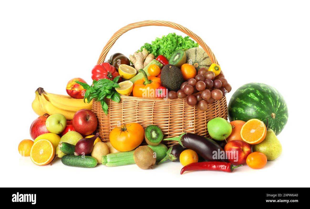 Many different fruits and vegetables in wicker basket isolated on white ...