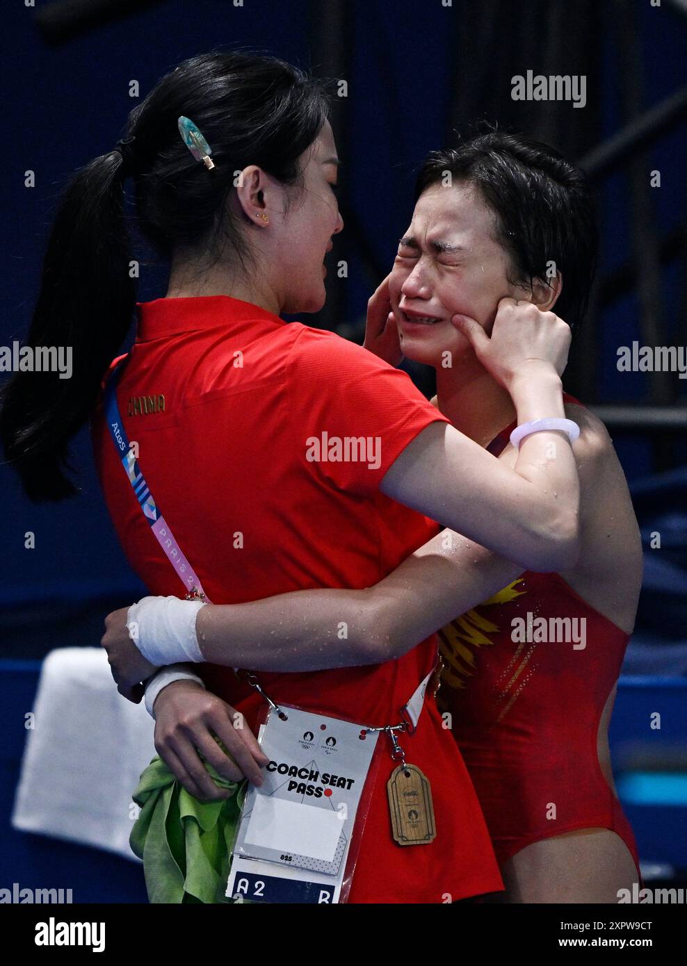 Beijing, France. 6th Aug, 2024. Quan Hongchan (R) of China reacts after ...